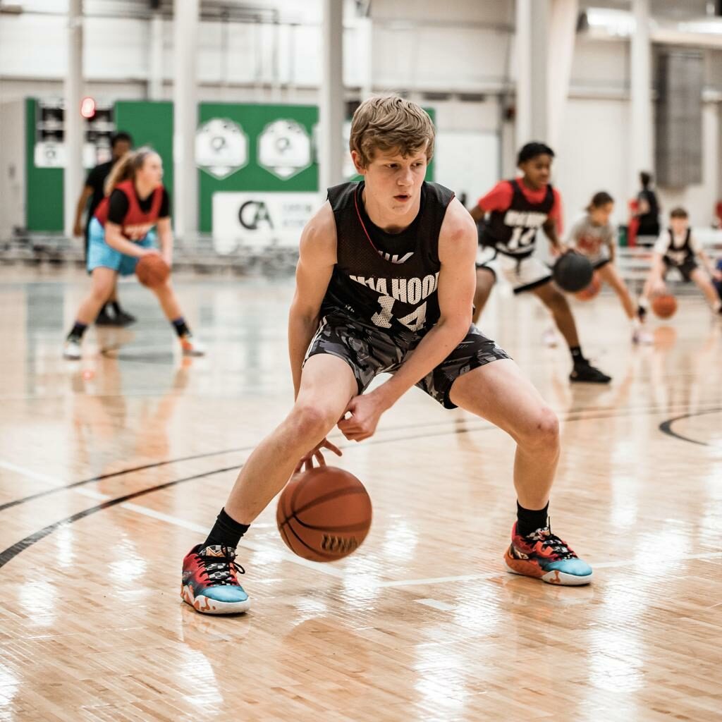 Elite basketball player learning new skills and shooting techniques.